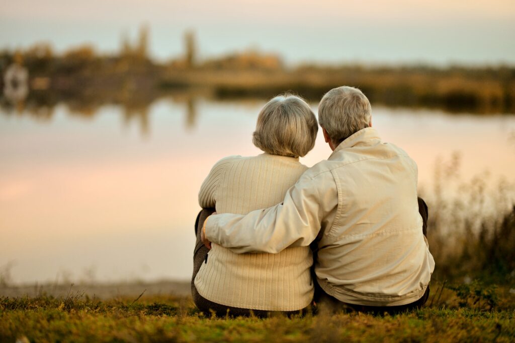 Elderly couple sitting next to each other