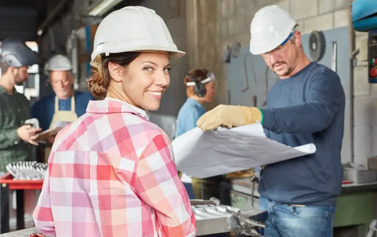 image of woman construction worker with hat, key terms for union workers, Disparti Law Group