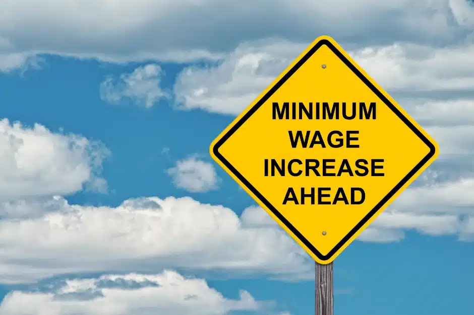 minimum wage increase 2025, image of traffic sign reading 'minimum wage increase ahead', Disparti Law Group