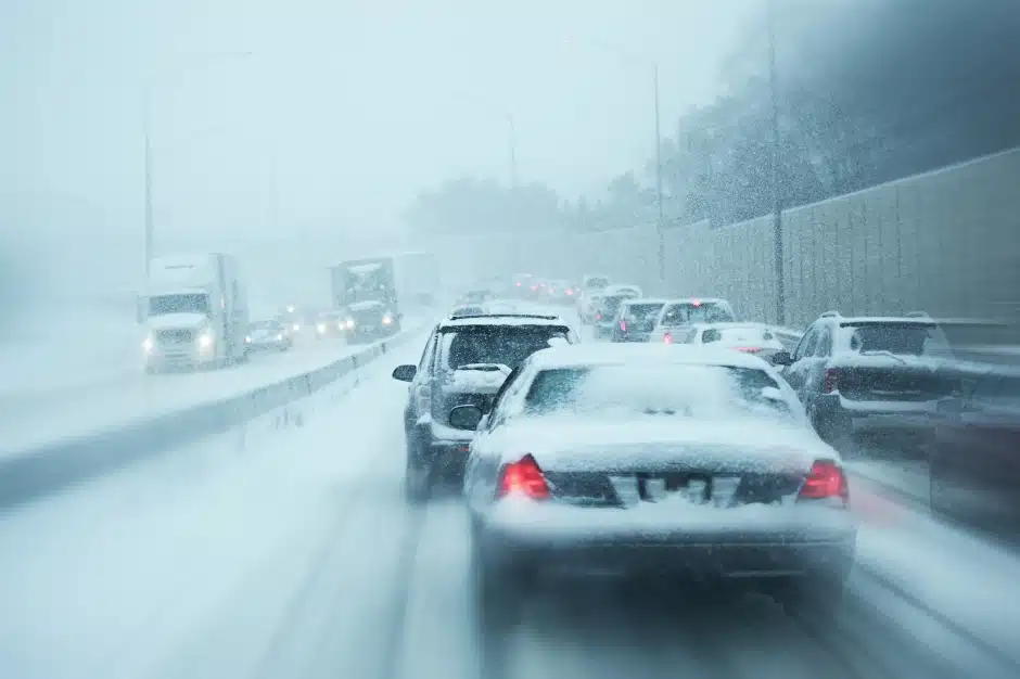 Image of vehicles on highway snow covered whiteout, Snow Squall, Disparti Law Group